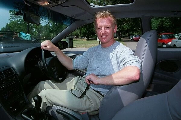Les Dennis Comedian  /  TV Presenter December 97 Sitting in the driving seat of the new