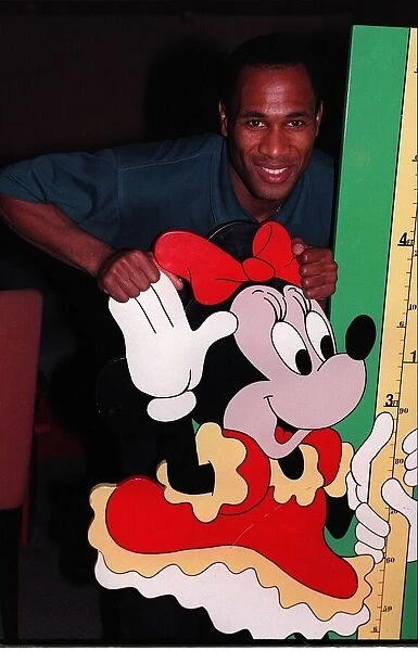 Les Ferdinand Football with cardboard cut out of Minnie Mouse cartoon character