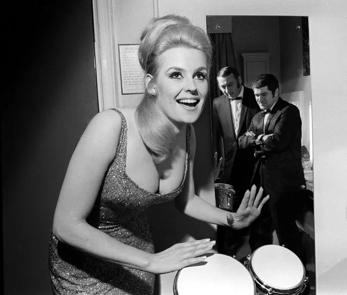Framed Print : Lesley Langley April 1967 former Miss World on the bongo watched by her new partners jazz