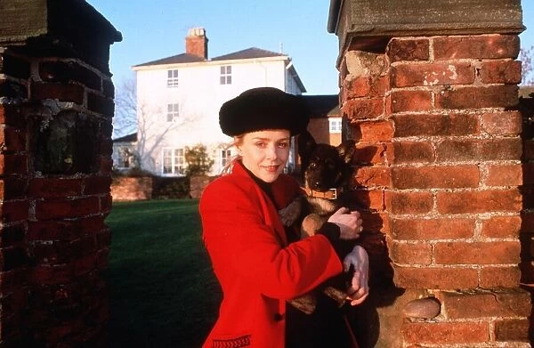 Leslie Ash actress at home with an alsatian puppy