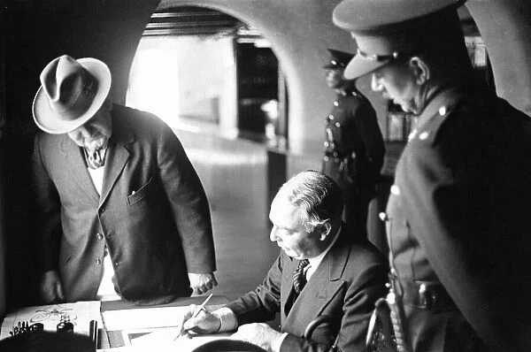 Leslie Hore-Belisha Secretary of State for War seen here signing the visitors book during