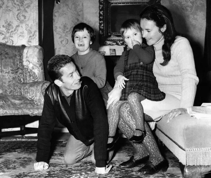 Framed Print : Lester Piggott plays horse for daughter Maureen at his home while his wife, Susan Framed Print : Lester Piggott plays horse for daughter Maureen at his home while his wife, Susan