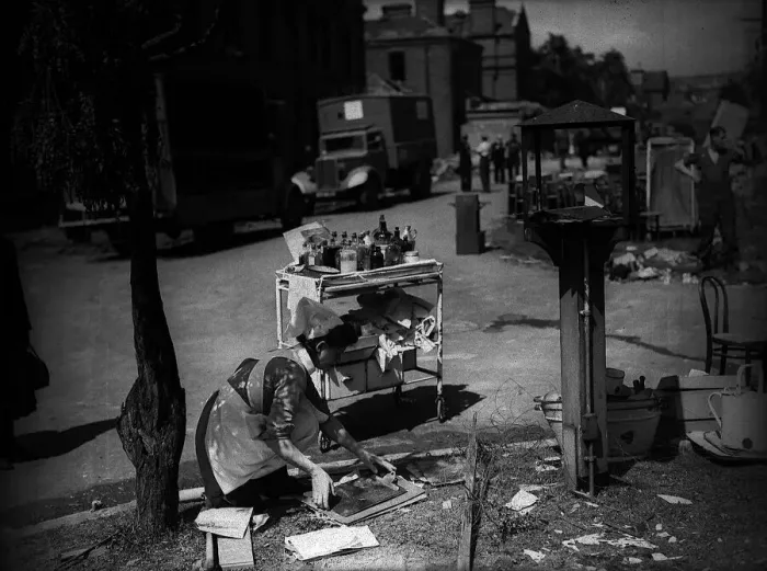 Framed Print : Lewisham Hospital after air Raid during WW2 1944 with nurse collecting some Framed Print : Lewisham Hospital after air Raid during WW2 1944 with nurse collecting some