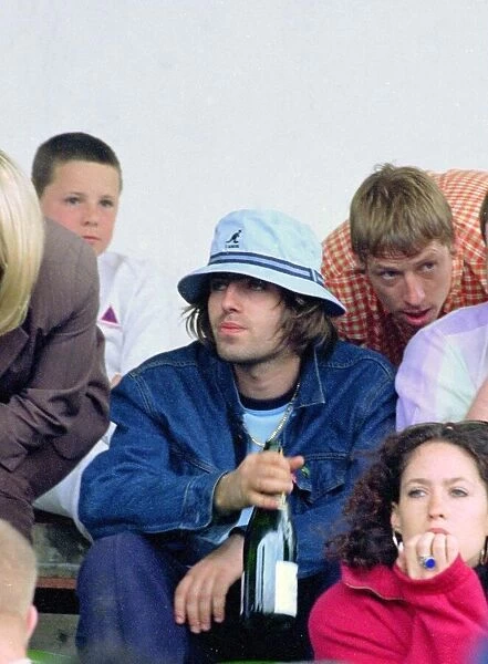 Liam Gallagher drinking wine - May 1996 Oasis v Blur football match Played at