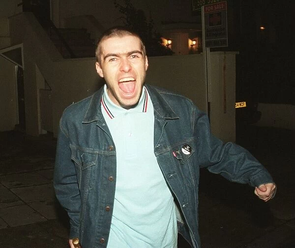 Liam Gallagher leaves home with new short hair style