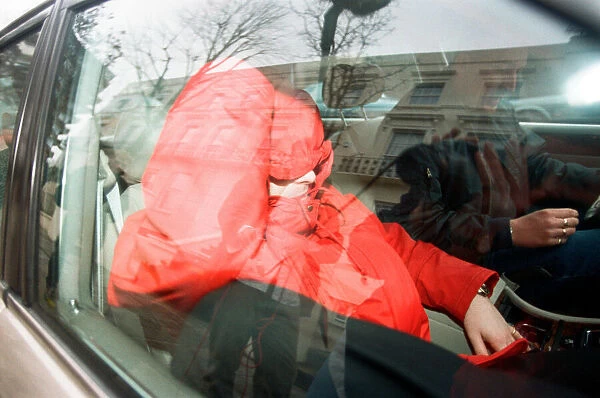 Liam Gallagher from Oasis (in red) leaving his London home