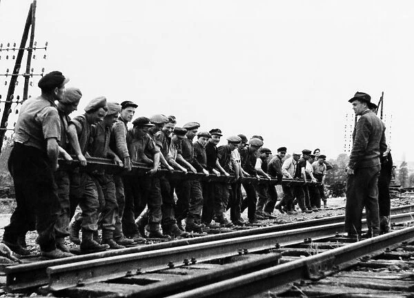 Liberation of Europe: British Sappers and French railmen repair damaged Normandy railway