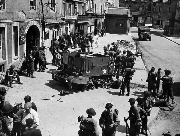 Liberation of Europe British troop sin Normandy. A street scene in Douvers