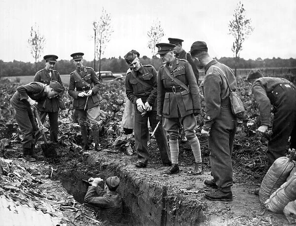 Lieutenant General Sir John Dill inspecting soldiers at work digging trenches in France