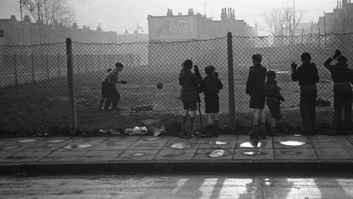 Framed Print : Life in the Mirror Our Gang. 19th January 1954 Boys playing football watched on by