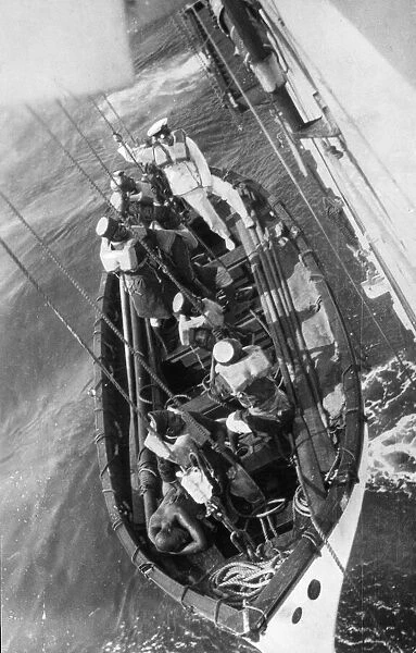 A lifeboat makes a sea rescue at Torquay on the South Devon coast. 26th March 1932