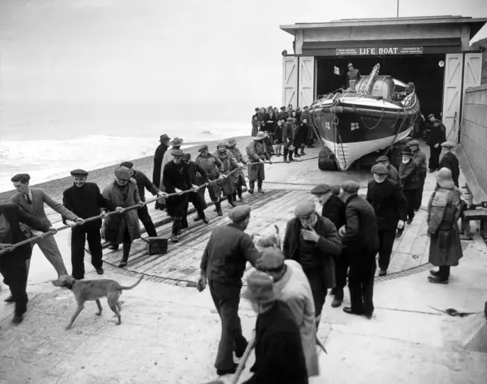 Framed Print : Lifeboatmen of Sheringham, Norfolk stand by during operational flights over the North Sea Framed Print : Lifeboatmen of Sheringham, Norfolk stand by during operational flights over the North Sea