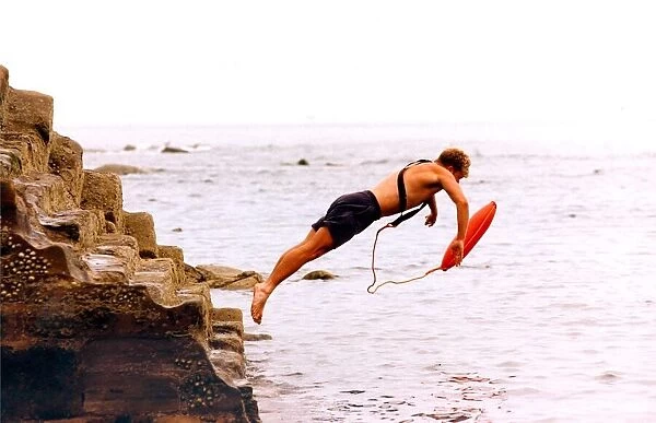 This lifeguard leaps into action during an exercise in July 1995