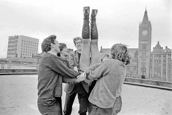 Lifted into the air by fellow actors. November 1969 Z11996-002