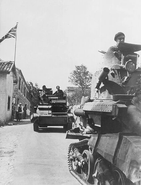 Light tanks rolling through a village on the island of Cyprus during the Second World war