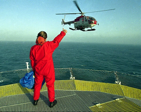 Lighthouse keeper Colin Jones seen here waiting on the helipad for the helicoptrt during