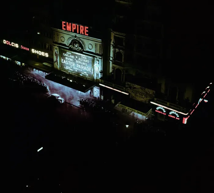 Framed Print : Lights of london. Empire cinema illuminated as crowds queue to watch the film