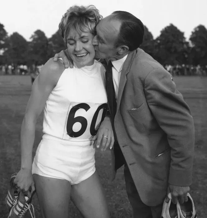 Framed Print : Lillian Board after breaking her own 880 yard track record at Reading gets a kiss Framed Print : Lillian Board after breaking her own 880 yard track record at Reading gets a kiss