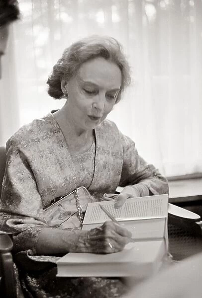Lillian Gish at the Grosvenor House Hotel giving autograph August 1969