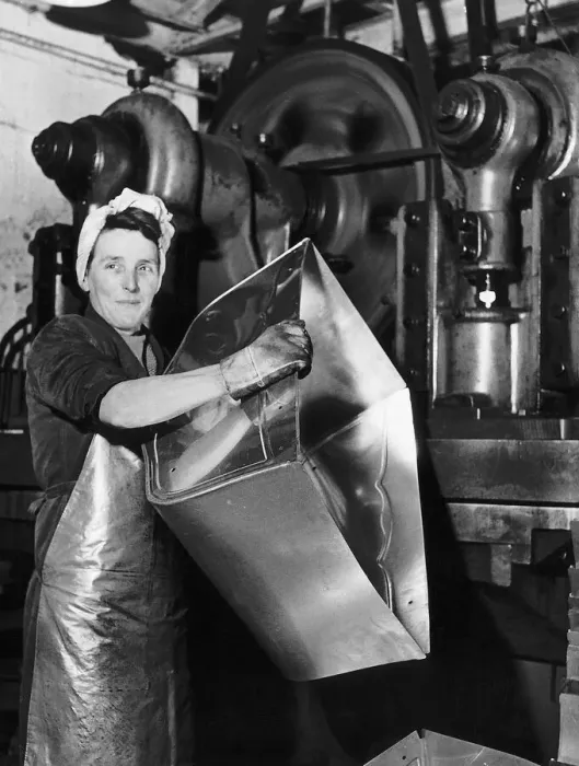 Framed Print : Lily Hill at her giant press stamping out the metal foundations of baby prams at a Framed Print : Lily Hill at her giant press stamping out the metal foundations of baby prams at a