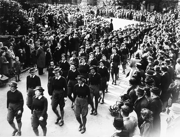 Lincoln VE Day Parade, Land Army girls march passed the cathedral. Circa 15th May 1945