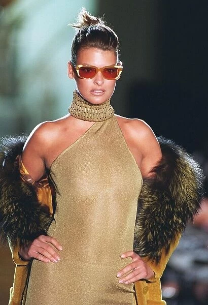 Linda Evangalista models for Versace at Paris fashion show Gold dress with collar