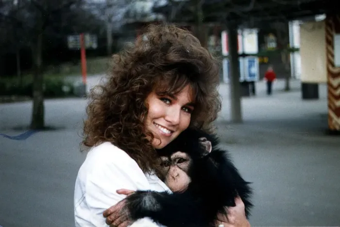 Framed Print : Linda Lusardi Model  /  TV Presenter holding baby monkey January 1990 A©mirrorpix