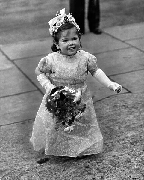 Linda May Jones aged 2 arrives to be a bridesmaid. 1st January 1950