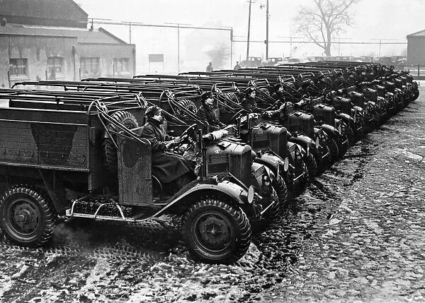 Line of army vehicles with ATS drivers ready to be convoyed to their destinations from a