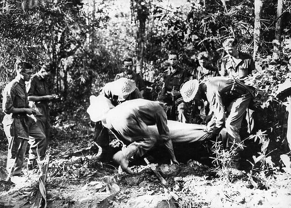 Front line burial of a British soldier shot by Japanese on the road to Mandalay