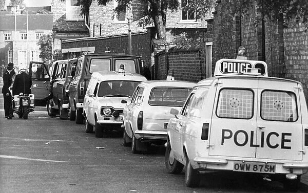A line of police cars and vans in a Newcastle Street