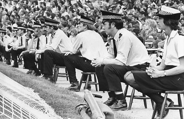 A line of policemen and women control the Newcastle United fans at St James Park 21