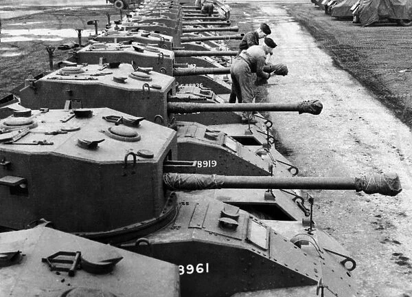 Lines of A. E. C armoured fighting vehicles with 6 pounder gun at an ordnance depot