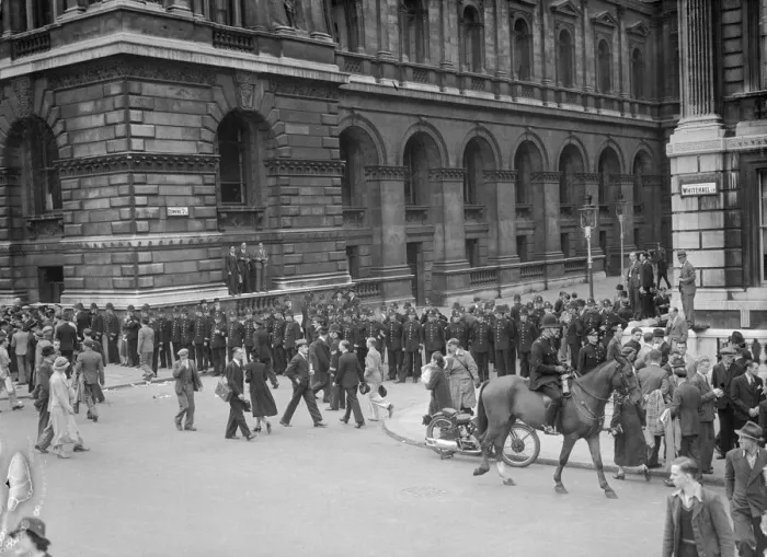 Framed Print : Lines of policemen guard the entrance to Downing Street after the return of British Prime Framed Print : Lines of policemen guard the entrance to Downing Street after the return of British Prime