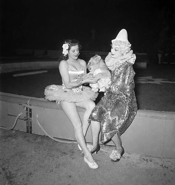 Lion Cub with Performers. Female clown and ballerina. December 1948 O16187-002