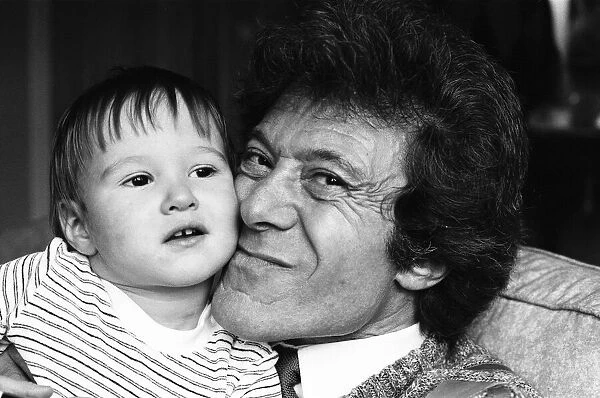 Lionel Blair pictured at home with his son. 19th October 1983