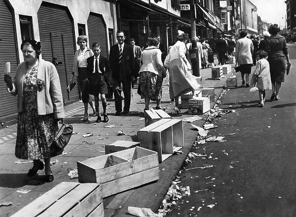 Litter lines the streets after Whit Monday walks May 1959