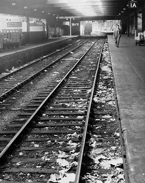 Litter on the tracks at New Street Station, Birmingham, West Midlands. 31st August 1955