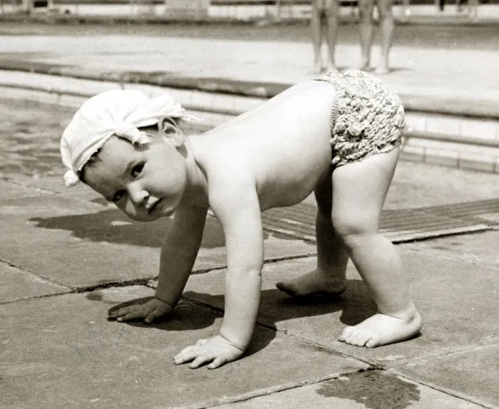 Framed Print : Little boy wearing a handkerchief on his head pictured balancing on all fours