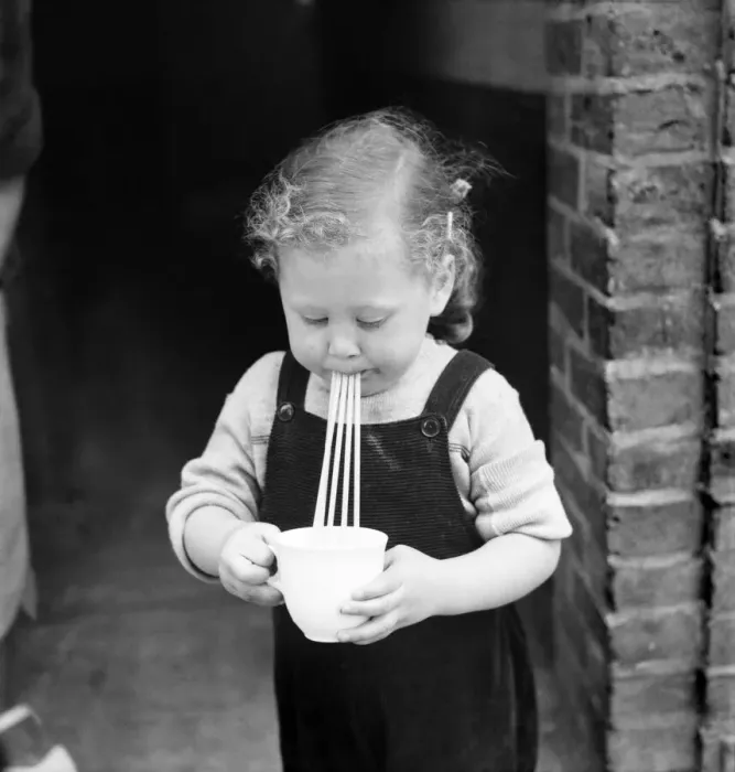 Framed Print : Little girl drinks through 4 straws. September 1952 C4389 Framed Print : Little girl drinks through 4 straws. September 1952 C4389