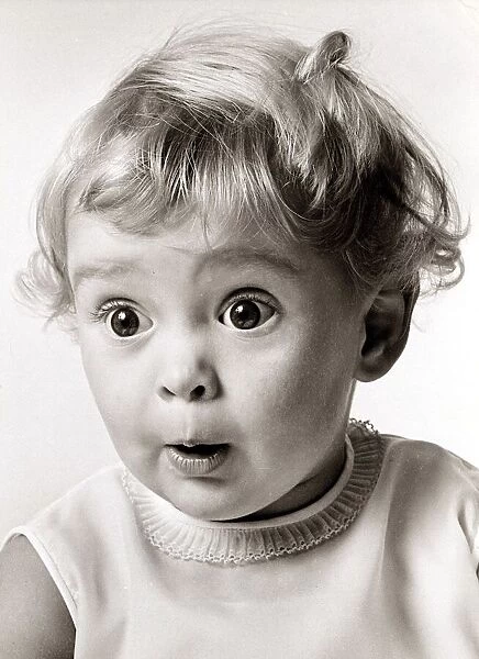 Little girl with a very surprised face expression, circa 1970