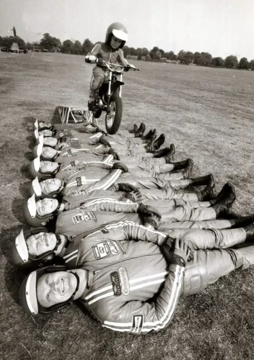 Framed Print : Little John Shipley leaps over 9 men on his motorcycle - 1976 Motor Cycles - Stunts