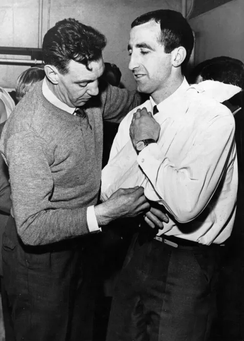 Framed Print : Liverpool assistant trainer Joe Fagan puts the injured right shoulder of Gerry Byrne in a Framed Print : Liverpool assistant trainer Joe Fagan puts the injured right shoulder of Gerry Byrne in a