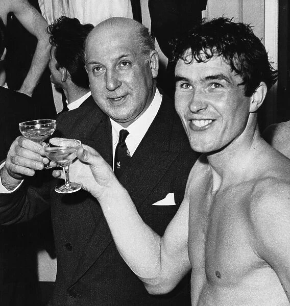 Liverpool captain Ron Yeats and Chairman My Sydney Reakes celebrate with a glass of