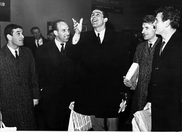 Liverpool captain Ron Yeats shows how the toss was made to decide the European Cup game