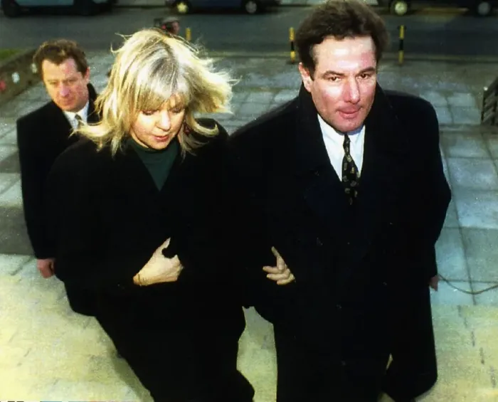 Framed Print : Former Liverpool Councillor Derek Hatton with his wife Shirley at Mold Crown Court for a