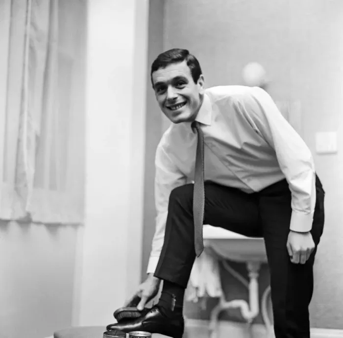 Framed Print : Liverpool and England footballer Ian Callaghan polishes his shoes ahead of his side