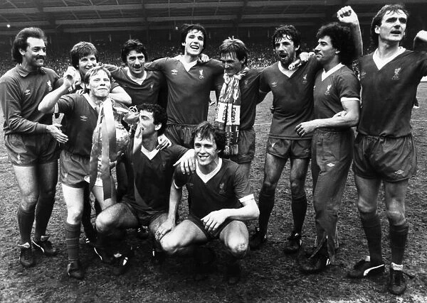 Liverpool FC players celebrate after winning the League for a record 13th time