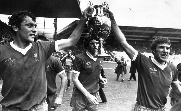 Liverpool Football team celebrate winning their 10th League title after a goalless draw
