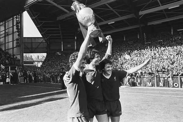 Liverpool Football team celebrate winning the League title after defeating Aston Villa